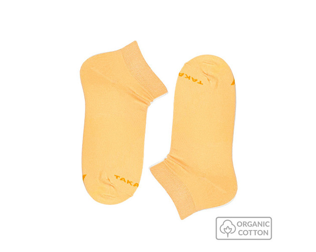 Jasnopomarańczowe stopki z bawełny organicznej