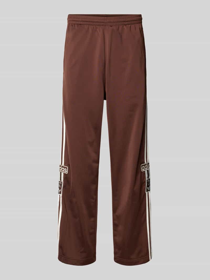 Spodnie sportowe o szerokim kroju z wyhaftowanym logo model ‘Adibreak’