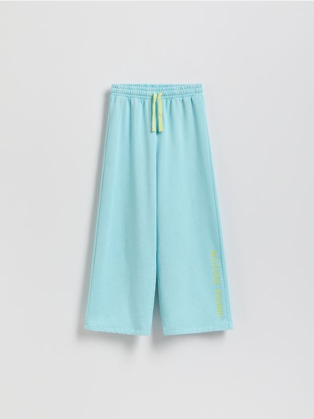 Reserved - Spodnie dresowe z nadrukiem - jasnoturkusowy