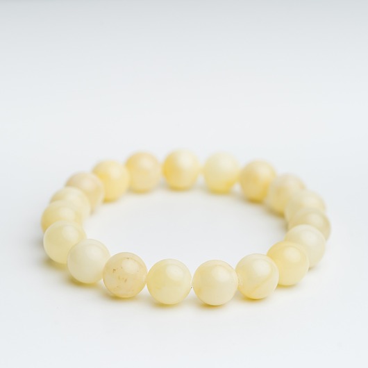 Bransoletka bursztyn mleczny biały regularna kulka