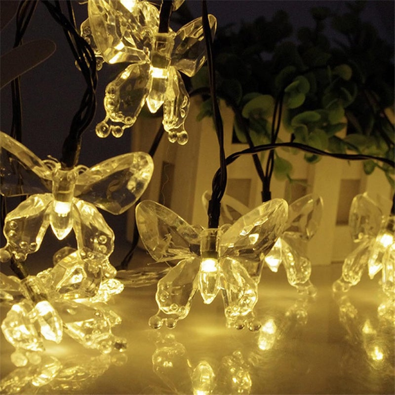 Lampki solarne LED do ogrodu, na taras i na imprezę, z 8 trybami oświetlenia (ciepłe białe motyle, 7 m/50 lampek)