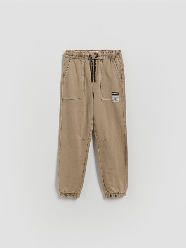 Reserved - Joggery z efektem sprania - zielony