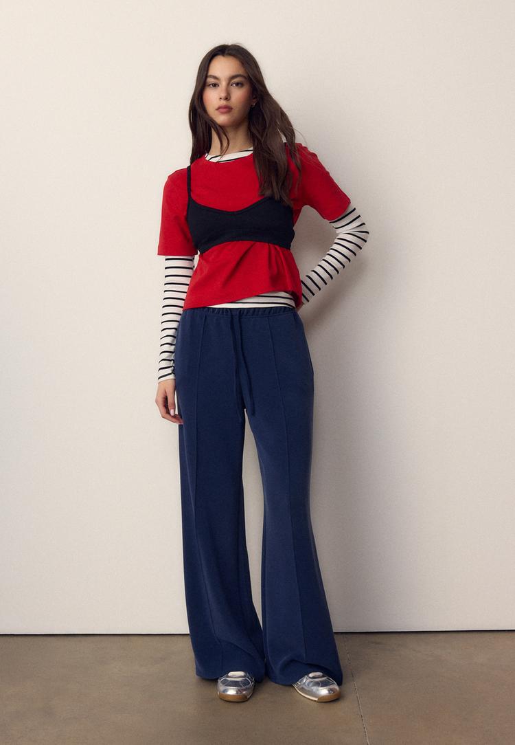 Stradivarius Miękkie spodnie jogger z szerokimi nogawkami i przeszyciami Morski XXS