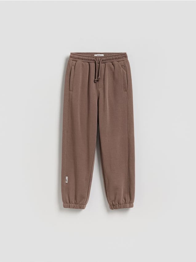 Reserved - Bawełniane spodnie jogger - brązowy