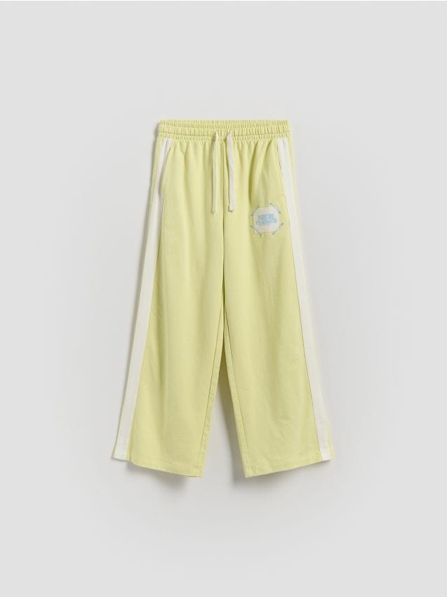 Reserved - Dresowe spodnie z lampasem - jasnożółty
