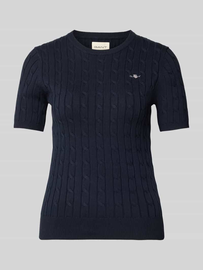 Bluzka z dzianiny ze ściegiem warkoczowym i wyhaftowanym logo