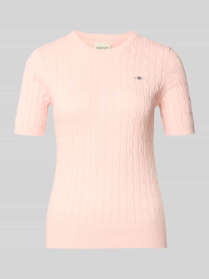 Bluzka z dzianiny ze ściegiem warkoczowym i wyhaftowanym logo