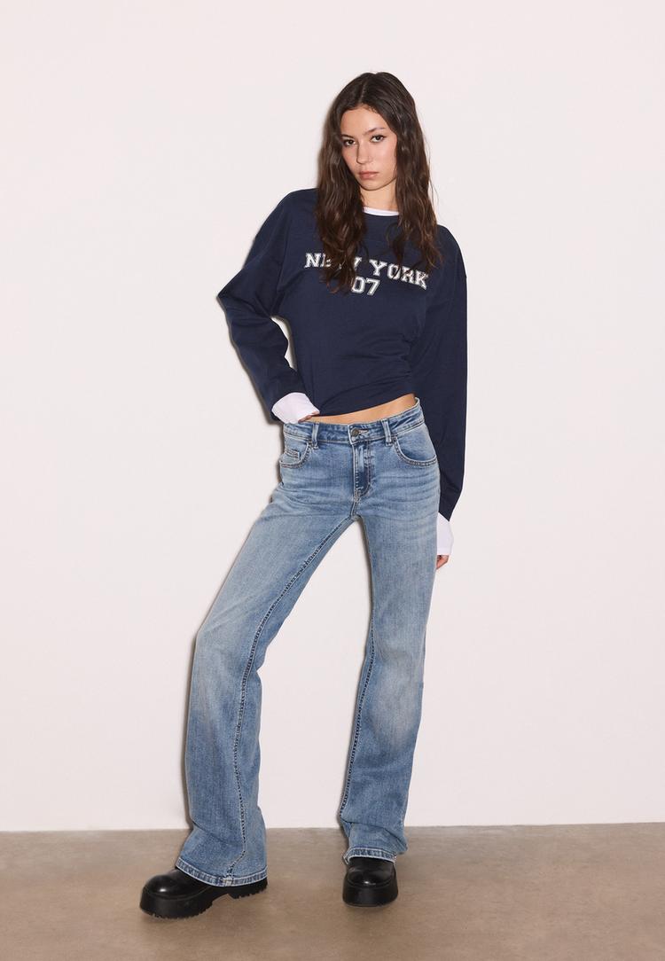 Stradivarius Jeansy dzwony z niskim stanem ŚREDNI NIEBIESKI DENIM 40