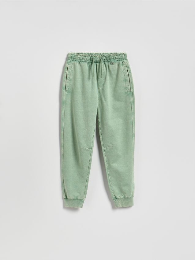 Reserved - Joggery z efektem sprania - jasnozielony