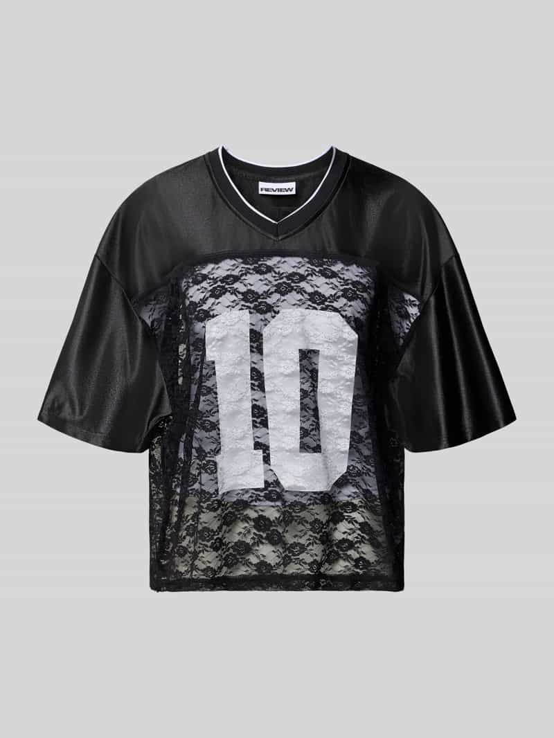 Sportowy trykot z koronki z elementami nadruku