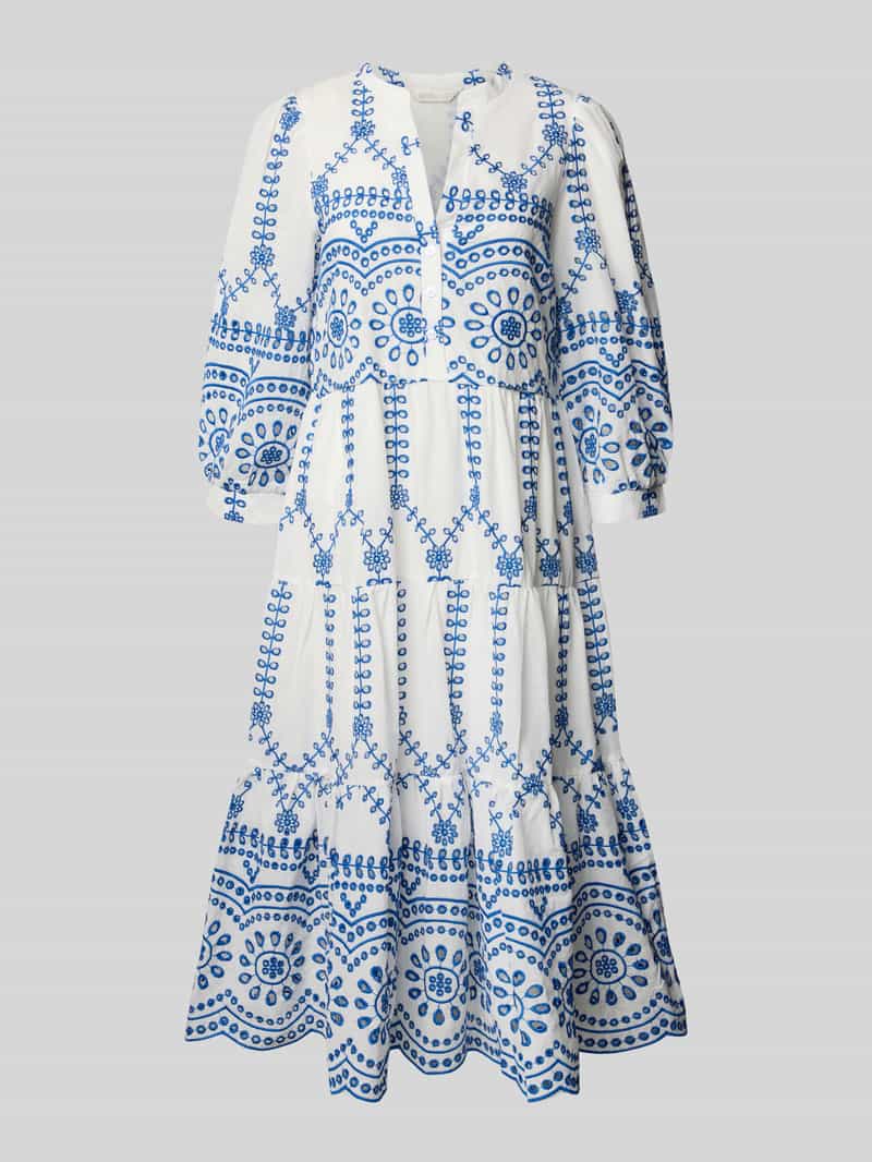 Sukienka tunikowa z dołem obszytym falbaną i haftem angielskim