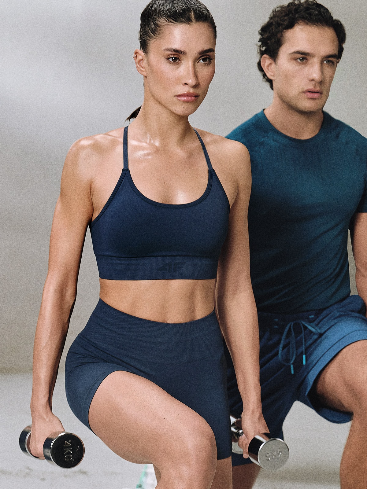 4F Biustonosz treningowy bezszwowy z niskim wsparciem damski - turkusowy XS/S