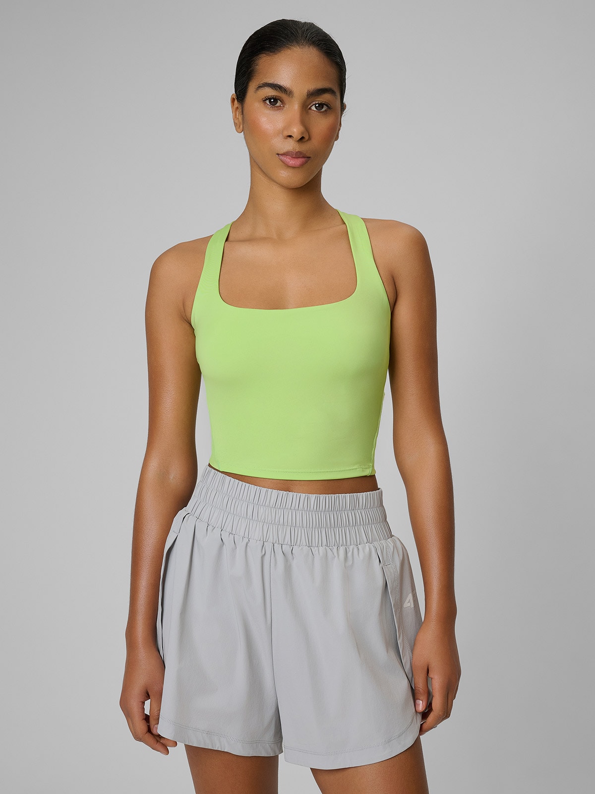 4F Crop top treningowy slim szybkoschnący damski - zielona XS