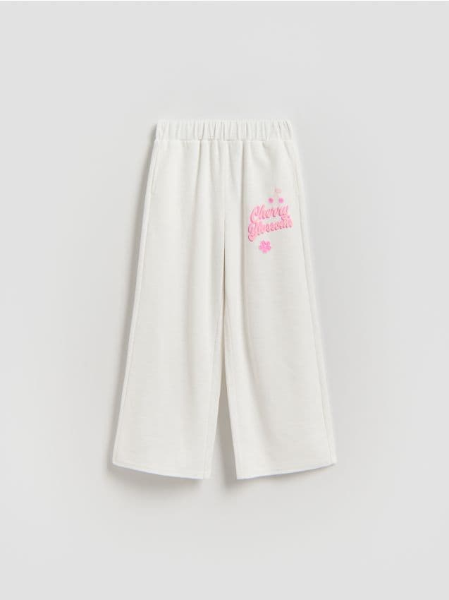 Reserved - Spodnie dresowe z nadrukiem - złamana biel