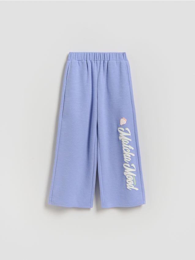 Reserved - Spodnie dresowe z nadrukiem - jasnoniebieski