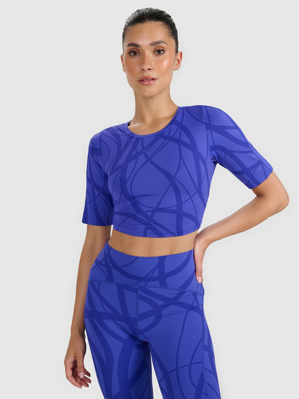 4F Crop-top treningowy szybkoschnący damski - niebieski L