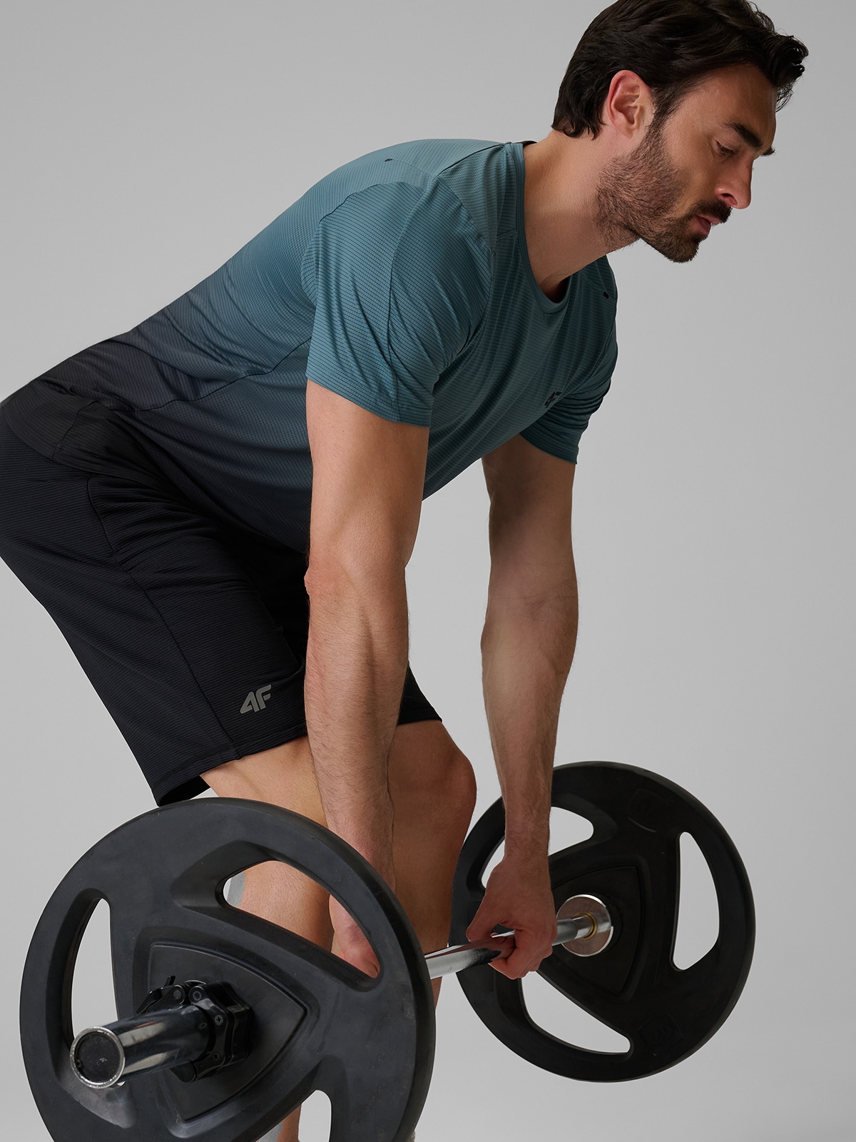 4F Koszulka treningowa regular szybkoschnąca męska - turkusowa XXL