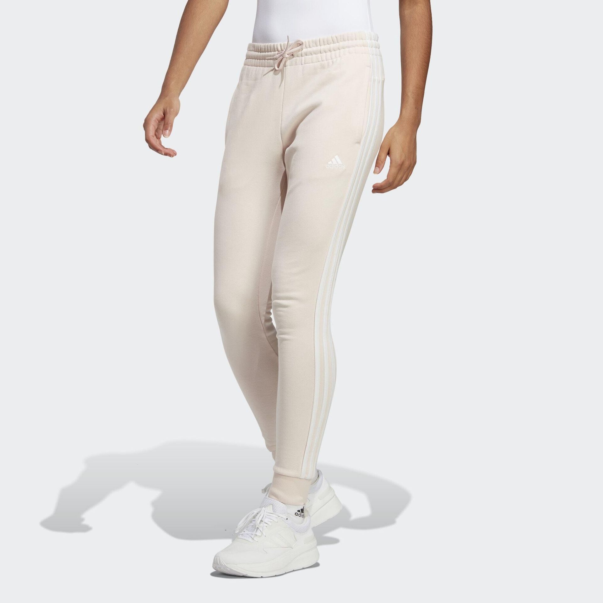Spodnie damskie adidas Essentials 3-Stripes French Terry Cuffed kremowe IC9