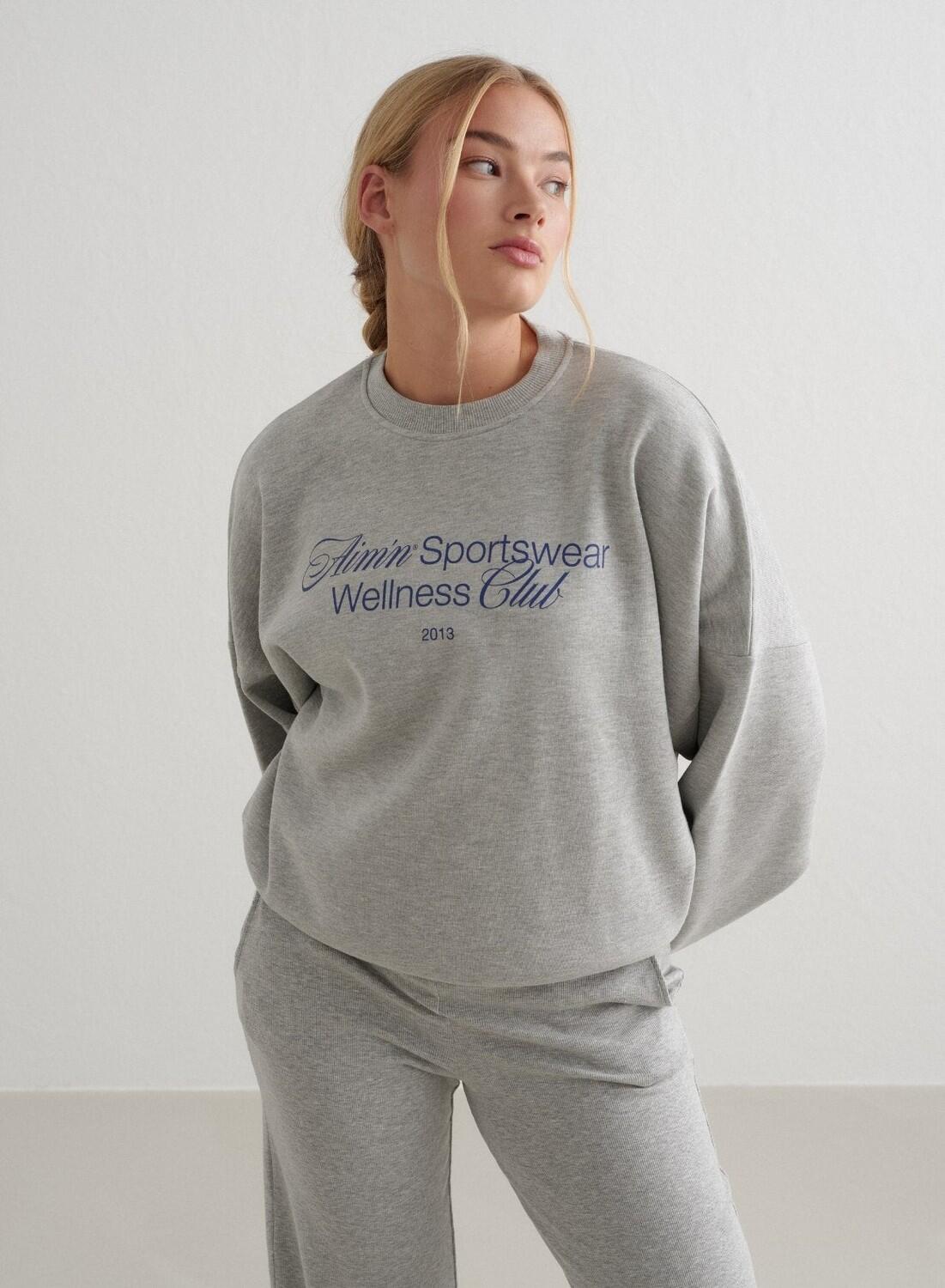 Damska bluza dresowa miękka, luźna, z okrągłym dekoltem Wellness szary melanż