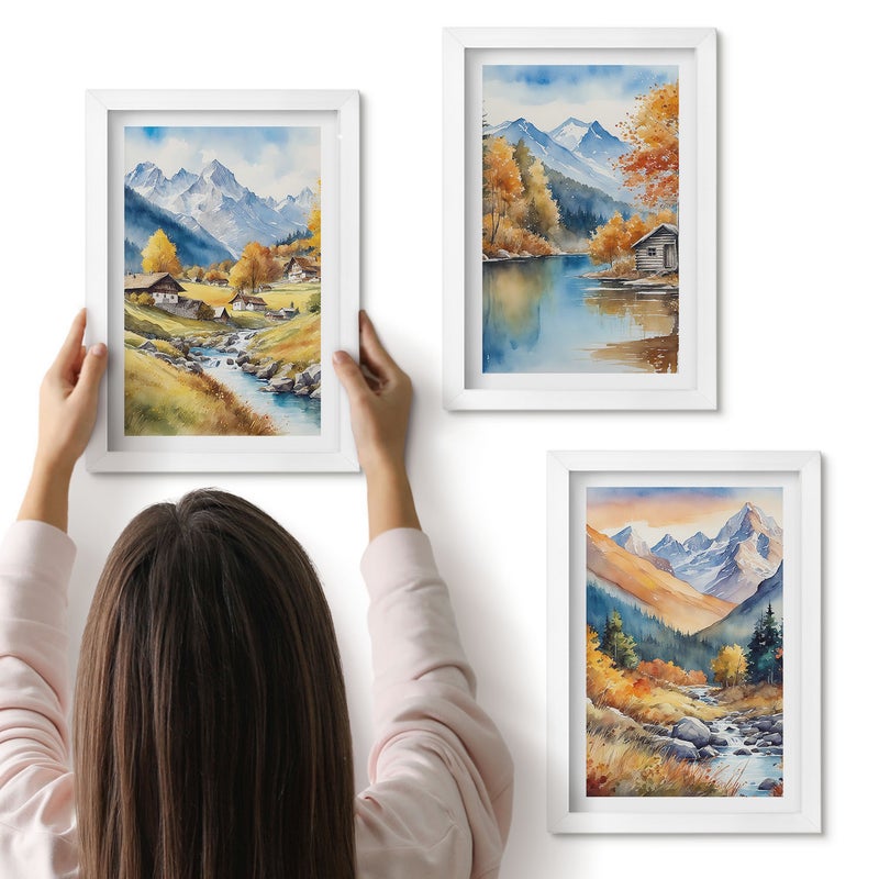 Galeria ścienna 3-częściowy komplet obrazów w białych ramach - Malowane jesienne góry z rzeką i domkami - ArtPrintCave