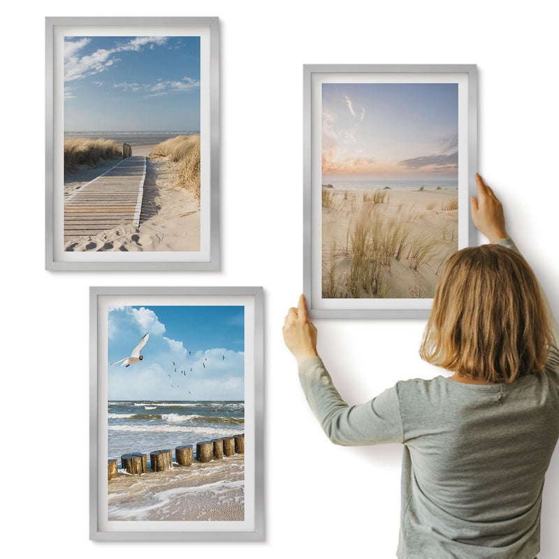 Galeria ścienna 3-częściowy komplet obrazów w srebrnych ramach - Plaża z piaskiem fale niebo i ptaki w locie - ArtPrintCave