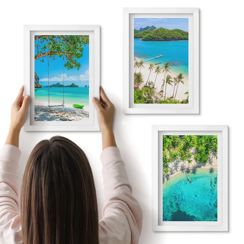 Galeria ścienna 3-częściowy komplet obrazów w białych ramach - Tropikalne plaże z palmami i krystalicznie czystą wodą - ArtPrintCave