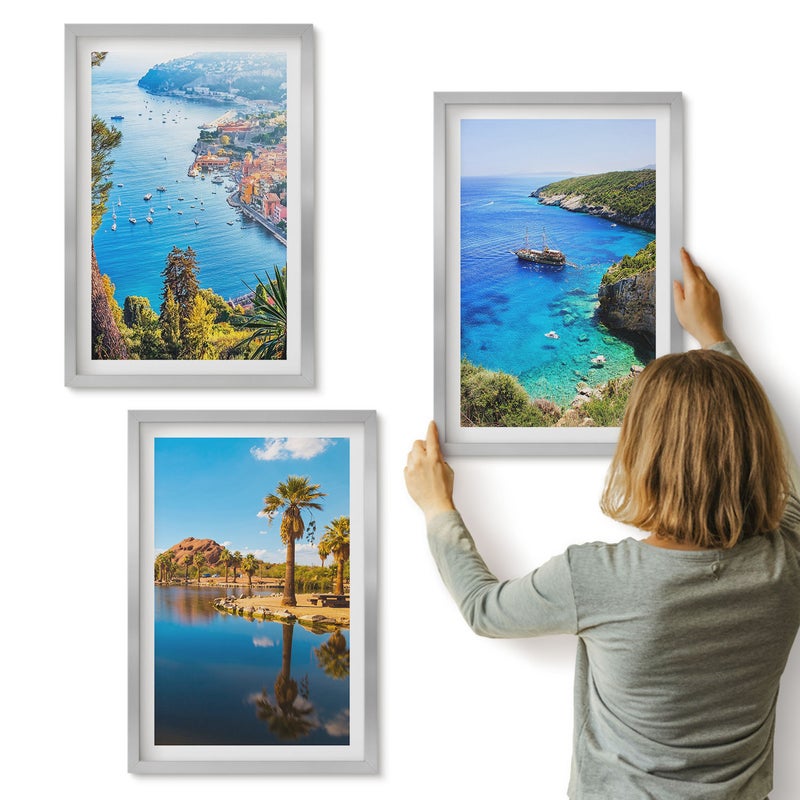 Galeria ścienna 3-częściowy komplet obrazów w srebrnych ramach - Widoki nadmorskie z palmami i błękitną wodą - ArtPrintCave