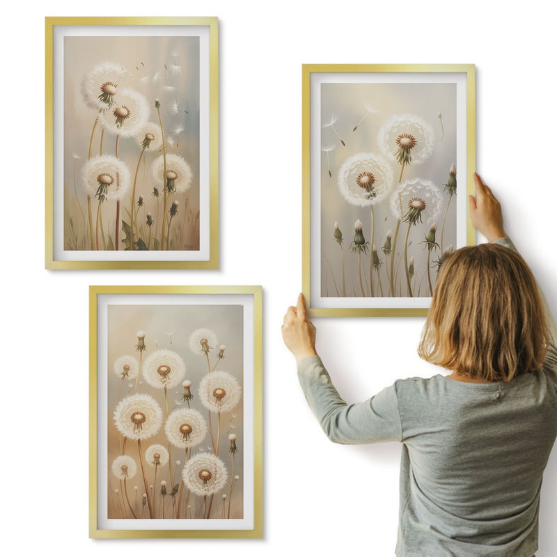 Galeria ścienna 3-częściowy komplet obrazów w złotych ramach - Białe dmuchawce na tle jasnych kolorów - ArtPrintCave