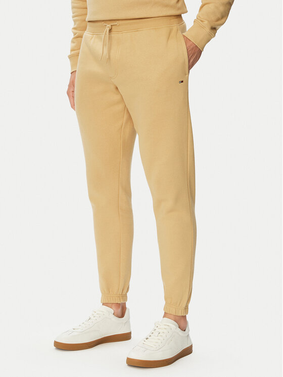 Tommy Jeans Spodnie dresowe Flag DM0DM20473 Beżowy Slim Fit