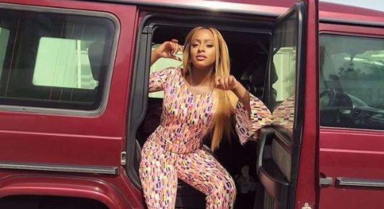 DJ Cuppy with one of her dad's G Wagon