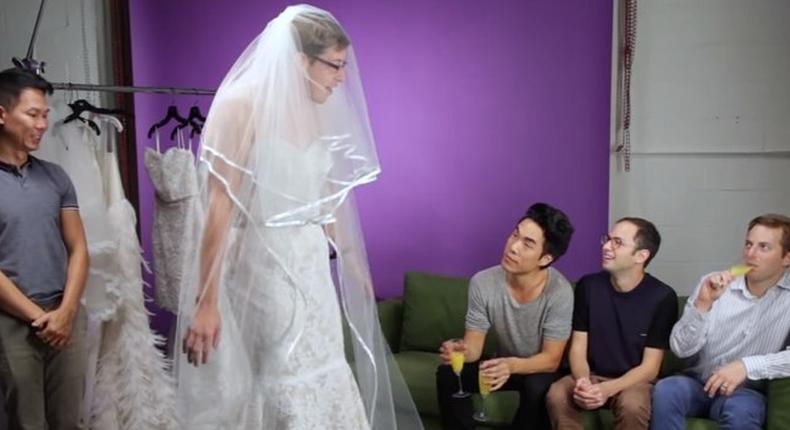 Men try wedding dresses for the first time
