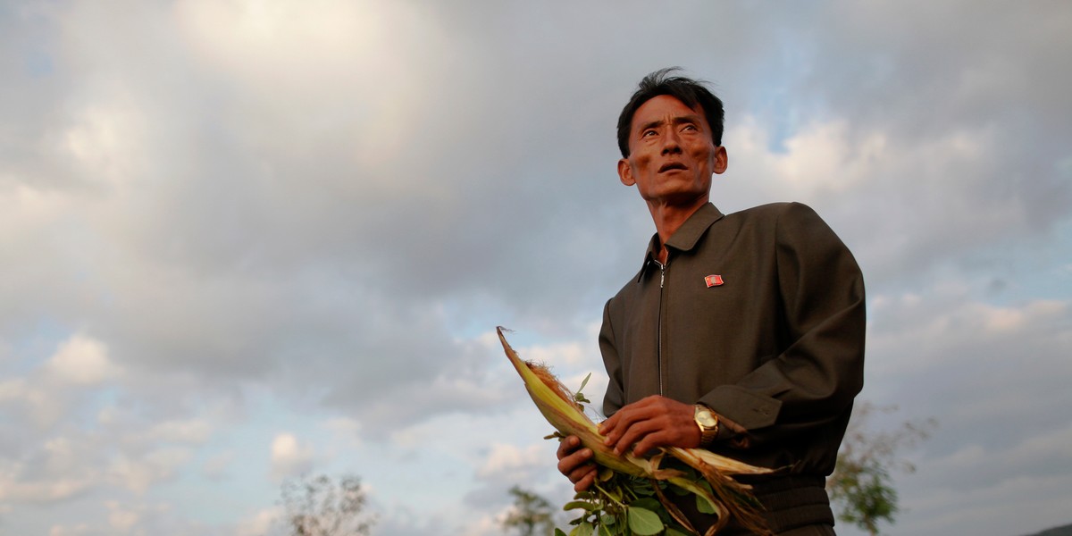 Pak Su Dong, manager of the Soksa-Ri cooperative farm in an area hit by floods and typhoons, shows damage to agricultural products in the South Hwanghae province September 29, 2011.