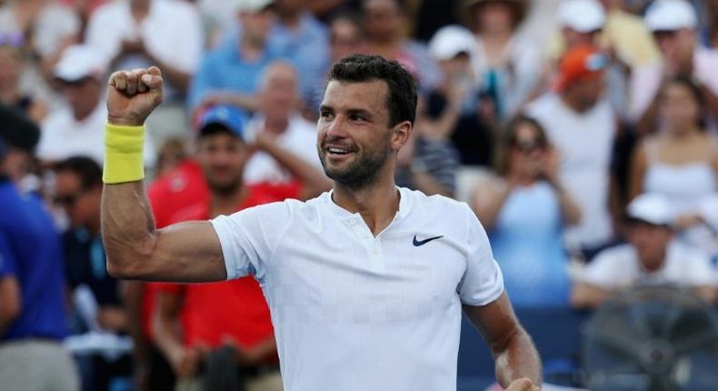 Grigor Dimitrov of Bulgaria celebrates after defeating Nick Kyrgios of Australia to win the Cincinnati Masters