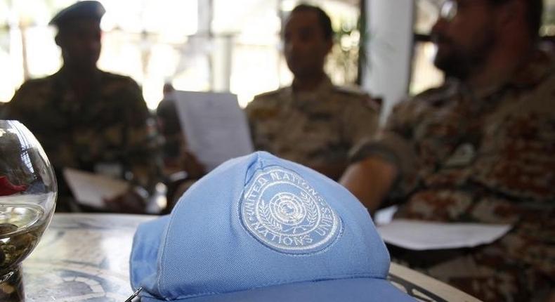 A blue United Nations cap is left near members of the U.N. observers mission in Syria, who have left their bases in the province of Homs in Central Syria, as they check their departure dates in a hotel in Damascus August 20, 2012. REUTERS/Khaled al-Hariri