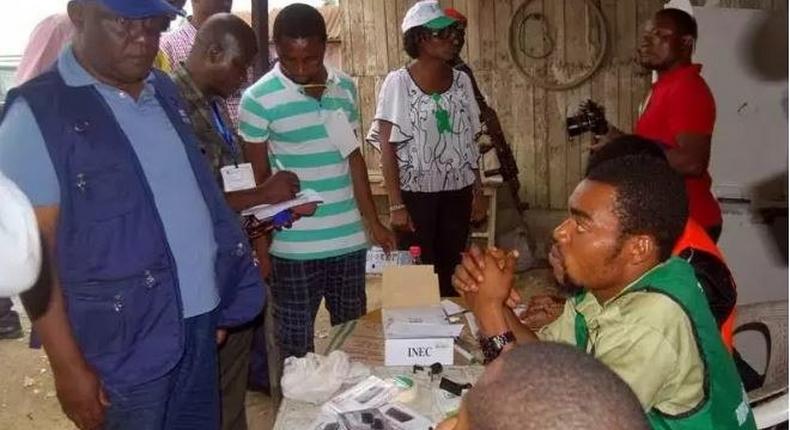 INEC staff during an election [Punch]