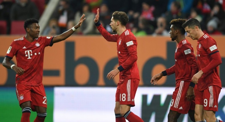 David Alaba (L) celebrates with Leon Goretzka (C) after the Austrian defender scored the winning goal