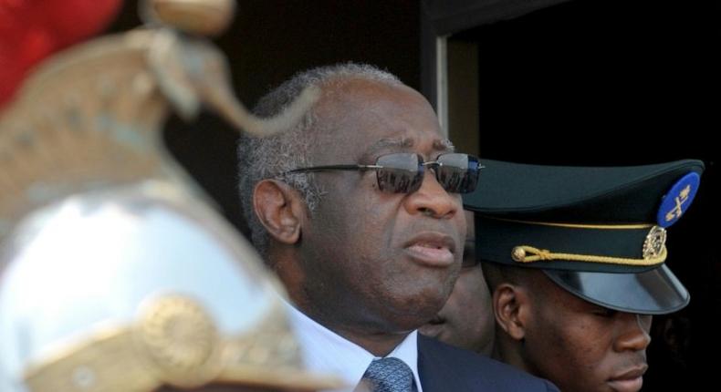 Former Ivorian president Laurent Gbagbo (C) is the first ex-head of state to be tried by the International Criminal Court