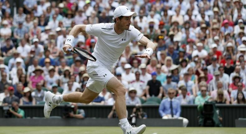 Britain's Andy Murray runs to return to France's Benoit Paire at Wimbledon on July 10, 2017