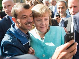 Merkel visits refugee shelter