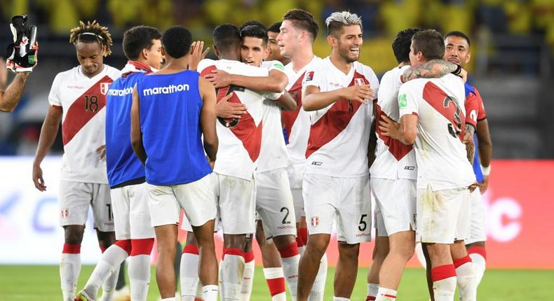 Peru's players celebrate after Edison Flores scored a late winner to defeat Colombia in a South American World Cup qualifier Creator: DANIEL MUNOZ