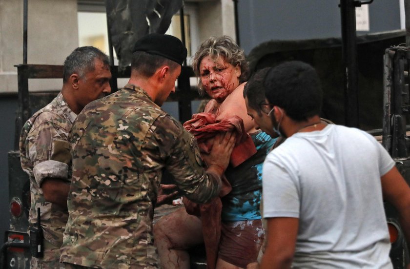 Damaged vehicle and buildings are pictured near the site of Tuesday's blast in Beirut's port area