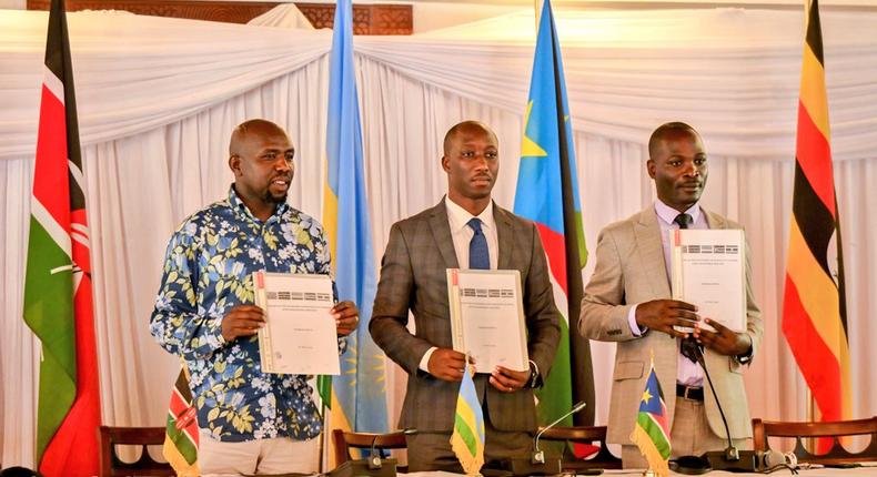 Hon. Kipchumba Murkomen (Cabinet Secretary, Ministry of Roads and Transport, Kenya), Hon. Jimmy Gasore (Minister of Infrastructure, Rwanda), and Hon. Fred Byamukama (Uganda's State Minister for Transport) display a signed report following the Joint Ministerial Committee meeting for the development of the Standard Gauge Railways in Mombasa, Kenya, on Friday, May 3, 2024.