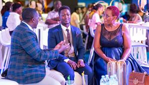 L-R: Brian Mulondo, the local content manager of MultiChoice Uganda, Jerry Sesanga the show director and Bina Baibe the host of the show, during the premiere of Mum Vs Wife.