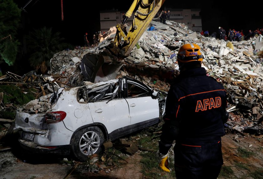 Rescue operations take place on a site after an earthquake struck the Aegean Sea, in the coastal pro