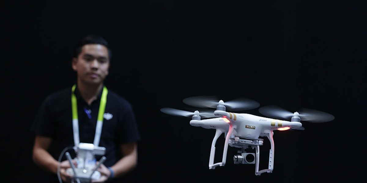 A DJI employee demonstrates flying a drone at Consumer Electronics Show 2016 in Las Vegas on Jan. 7, 2016. [Note: This is not the drone Walmart will be using. Images of Walmart's drone cannot yet be released.]