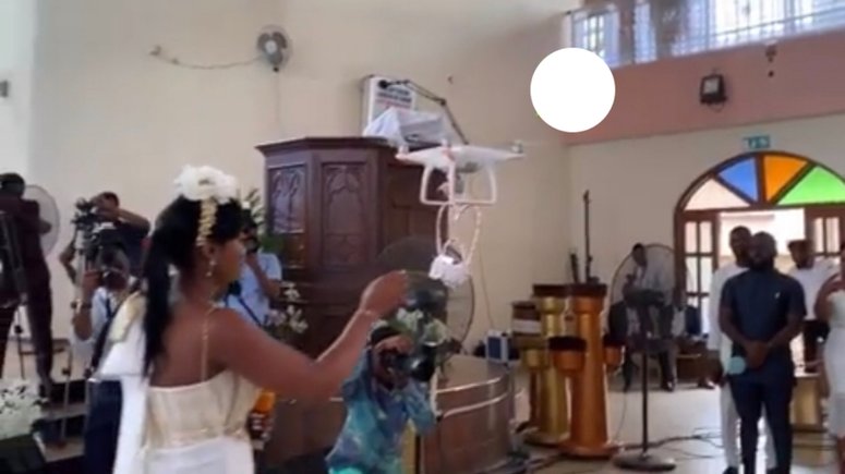 The moment drone delivers the rings for Despite’s son white wedding 