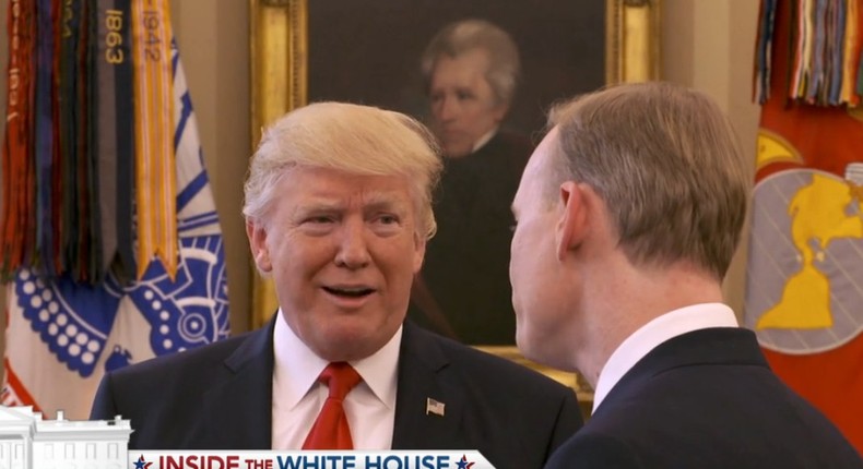 President Donald Trump and CBS anchor John Dickerson.