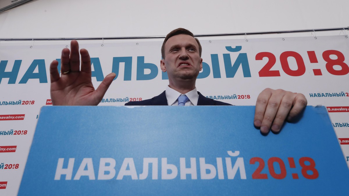 Russian opposition leader Alexei Navalny delivers a speech during a meeting to uphold his bid for pr