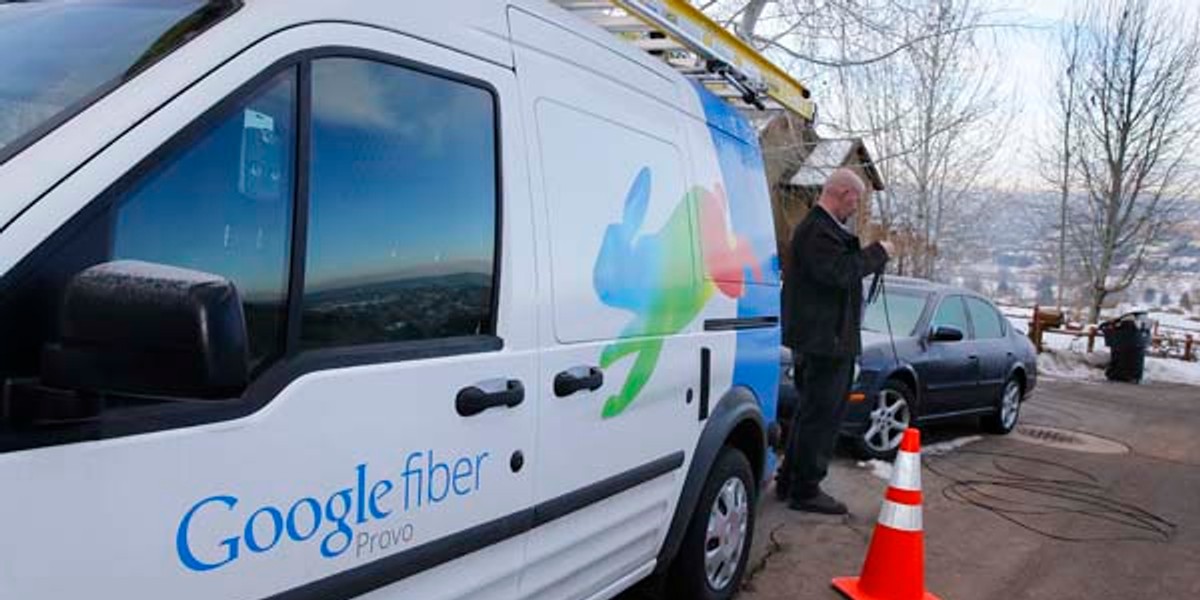 A technician gets cabling out of his truck to install Google Fiber in a residential home in Provo, Utah, January 2, 2014.