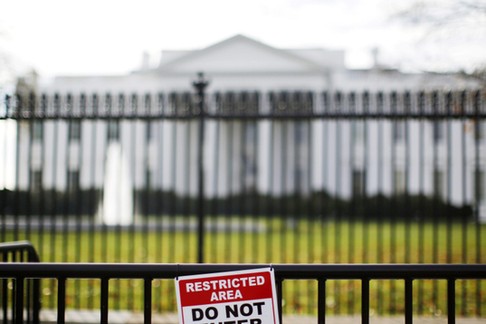 FILE PHOTO: A restricted area sign is seen outside of the White House in Washington